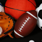Sport essentials like black and white soccer ball, red basketball, a football, baseball, etc.