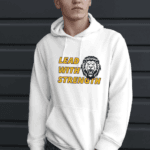 Some wears a pullover hoodie which has a text LEAD WITH STRENGTH
